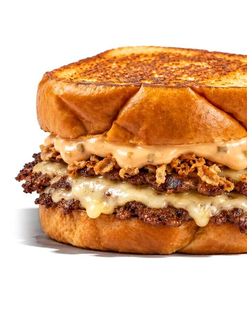 The Melt, smash burger de Woody's Factory : brioche au beurre, sauce maison, oignons frits, steaks smashés et emmental
